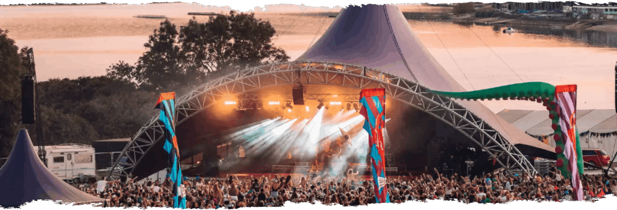 Outside stage with lighting showing the crowd